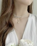 【SENTIMENTS】NO.414 RIBBON BOLL NECKLACE▲aespa着用 NO.414 RIBBON BOLL NECKLACE - SENTIMENTS | 60% - Asian